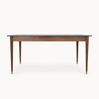Watson Walnut Dining Table on a neutral background